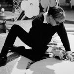 Andy at work on a large flower painting, the Factory, NYC, spring 1965